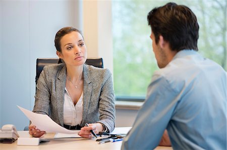 Business executive discussing with her client Stock Photo - Premium Royalty-Free, Code: 6108-06167914