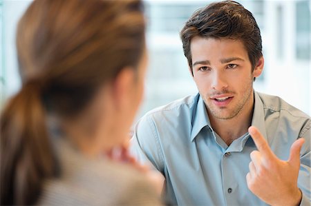 Business executive discussing with her client Stock Photo - Premium Royalty-Free, Code: 6108-06167916