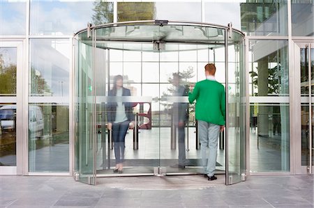 front entrance - Business executives at entrance of an office building Stock Photo - Premium Royalty-Free, Code: 6108-06168071