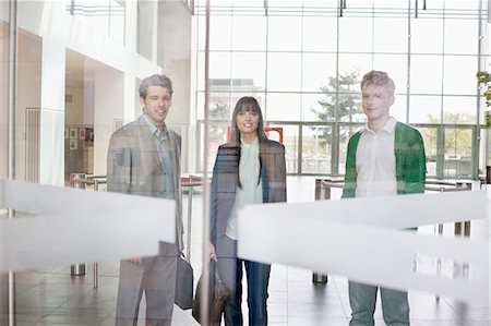entrance - Portrait of business executives in an office lobby Stock Photo - Premium Royalty-Free, Code: 6108-06168024