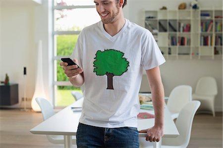 ecology and technology - Man using a mobile phone Stock Photo - Premium Royalty-Free, Code: 6108-06168143