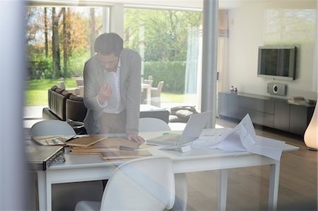 engineer working in laptop images - Interior designer working in the office Stock Photo - Premium Royalty-Free, Code: 6108-06168118