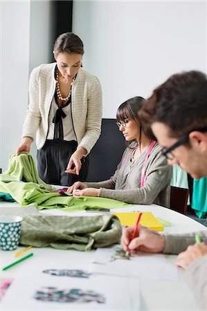 Fashion designers working in an office Stock Photo - Premium Royalty-Free, Code: 6108-06168269