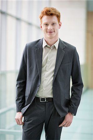 portrait of office worker - Portrait of a businessman smiling Stock Photo - Premium Royalty-Free, Code: 6108-06168354