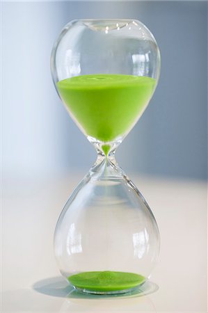 Close-up of an hourglass Stock Photo - Premium Royalty-Free, Code: 6108-06168397