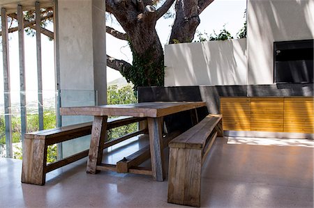 rustic modern - Picnic table and bench in a porch Stock Photo - Premium Royalty-Free, Code: 6108-06904413