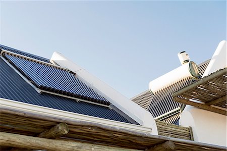 solar panels and roof - Solar panel on the roof of a house Stock Photo - Premium Royalty-Free, Code: 6108-06904415