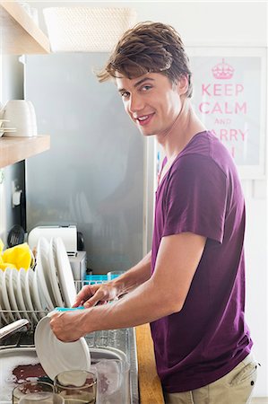 simsearch:6108-06904584,k - Man washing dishes in his kitchen Stock Photo - Premium Royalty-Free, Code: 6108-06904550