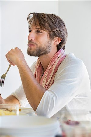 Man at dining table Stock Photo - Premium Royalty-Free, Code: 6108-06904962