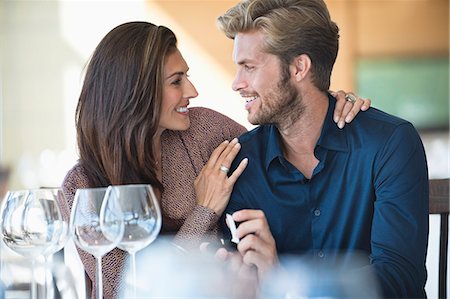 Man with engagement ring proposing his girlfriend in a restaurant Stock Photo - Premium Royalty-Free, Code: 6108-06905144