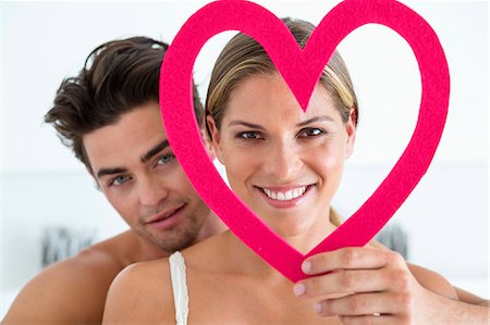 Couple with a heart shape object Foto de stock - Sin royalties Premium, Código: 6108-06905165