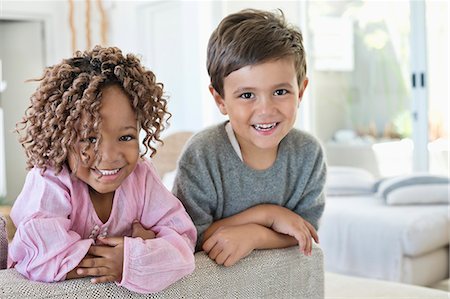 Portrait of a boy and girl smiling Photographie de stock - Premium Libres de Droits, Code: 6108-06905287