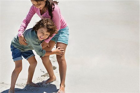 ethnic diverse boy and girl playing - Children playing on the beach Stock Photo - Premium Royalty-Free, Code: 6108-06905327