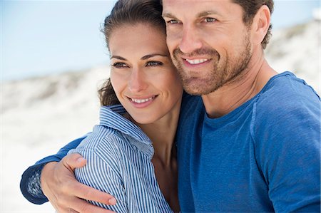 Close-up of a happy couple on the beach Stock Photo - Premium Royalty-Free, Code: 6108-06905496