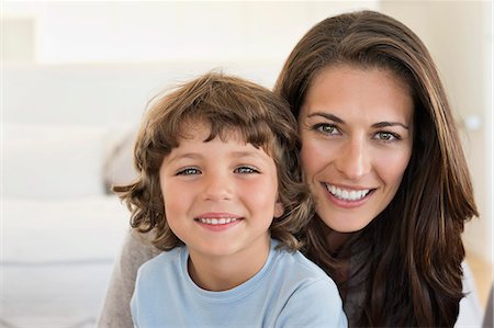 simsearch:6108-06907900,k - Portrait of a woman and her son smiling Stock Photo - Premium Royalty-Free, Code: 6108-06905607