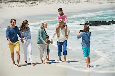 extended family walking outdoors - Family enjoying on the beach Stock Photo - Premium Royalty-Free, Code: 6108-06905908