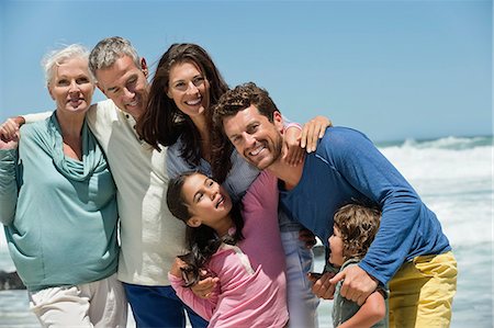 extended family - Family smiling on the beach Stock Photo - Premium Royalty-Free, Code: 6108-06905915