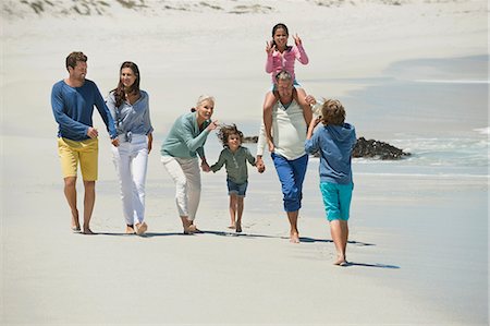 family outdoor walking and grandparents - Family enjoying on the beach Stock Photo - Premium Royalty-Free, Code: 6108-06905922