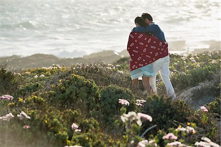 simsearch:6108-05869975,k - Couple walking on the beach Stock Photo - Premium Royalty-Free, Code: 6108-06906274