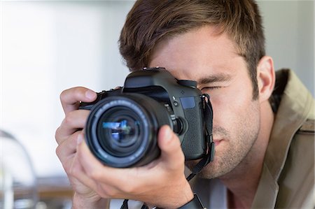 simsearch:614-06895809,k - Close-up of a man photographing with a camera Stock Photo - Premium Royalty-Free, Code: 6108-06906280