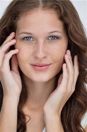 smile look at camera studioshot one person - Portrait of a beautiful woman posing Stock Photo - Premium Royalty-Free, Code: 6108-06906339