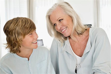 simsearch:6108-06906902,k - Woman and her grandson smiling at each other Photographie de stock - Premium Libres de Droits, Code: 6108-06906867