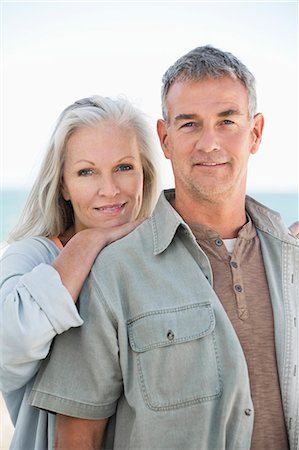 simsearch:6108-06906865,k - Portrait of a couple smiling Stock Photo - Premium Royalty-Free, Code: 6108-06906878