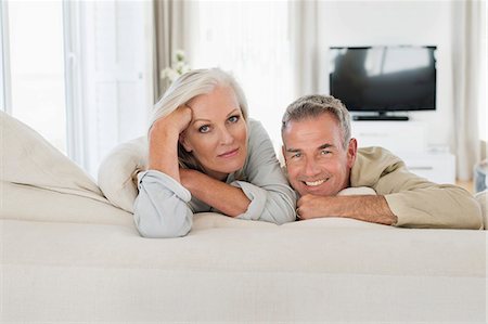 relaxed woman lying down - Senior couple resting on the bed Stock Photo - Premium Royalty-Free, Code: 6108-06906904