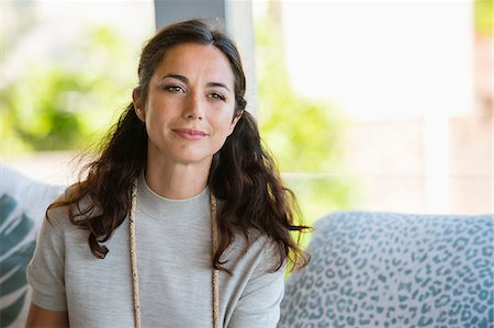 Close-up of a woman smiling Stock Photo - Premium Royalty-Free, Code: 6108-06907165