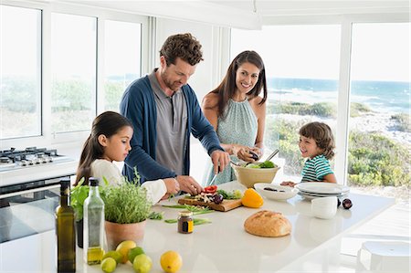 family hispanic father mother children boy girl - Family preparing food Stock Photo - Premium Royalty-Free, Code: 6108-06907108