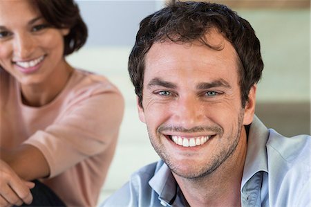 simsearch:6108-06907127,k - Portrait of a couple smiling Stock Photo - Premium Royalty-Free, Code: 6108-06907135