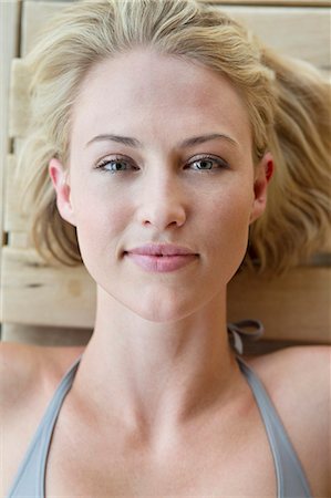 relaxed woman lying down - Portrait of a beautiful woman resting in a sauna Stock Photo - Premium Royalty-Free, Code: 6108-06907498