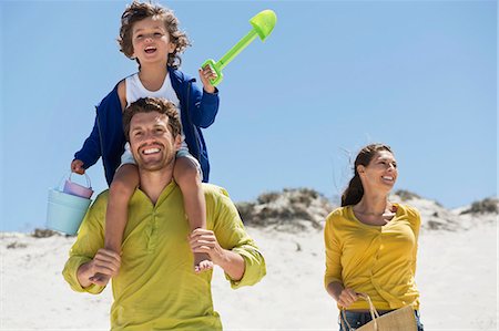 family with one child - Family enjoying on the beach Stock Photo - Premium Royalty-Free, Code: 6108-06907565