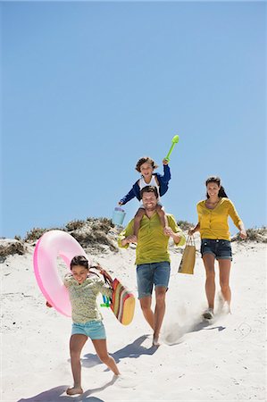 family photo summer - Family walking on the beach Stock Photo - Premium Royalty-Free, Code: 6108-06907578