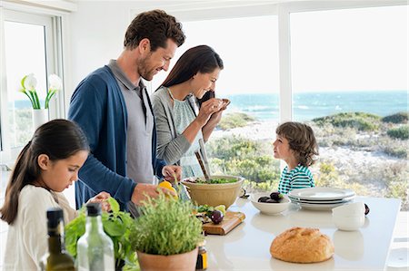 family hispanic father mother children boy girl - Family preparing food in the kitchen Stock Photo - Premium Royalty-Free, Code: 6108-06907597