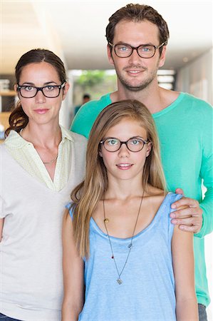 simsearch:6108-06907614,k - Portrait of a family wearing eyeglasses and smiling Stock Photo - Premium Royalty-Free, Code: 6108-06907658