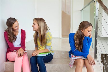 photos preteen school girls - Female friends sitting on stairs in a school Stock Photo - Premium Royalty-Free, Code: 6108-06907691