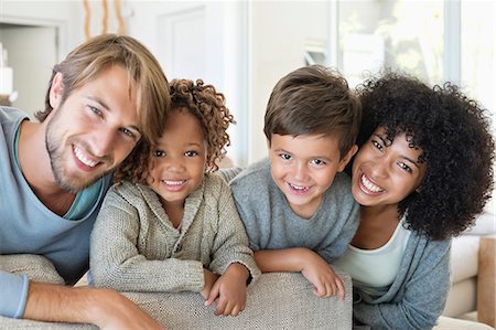 simsearch:6108-06905584,k - Portrait of a couple smiling with their children Foto de stock - Sin royalties Premium, Código: 6108-06907604