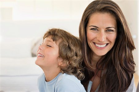 Portrait of a woman and her son smiling Stock Photo - Premium Royalty-Free, Code: 6108-06907895