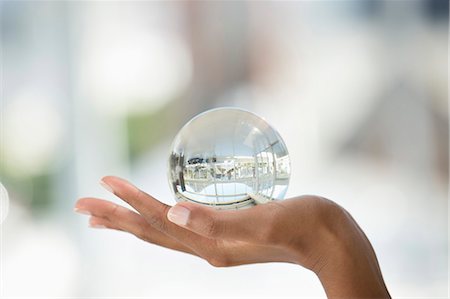 photographic images of glass - Close-up of a person's hand holding a crystal ball Stock Photo - Premium Royalty-Free, Code: 6108-06907803