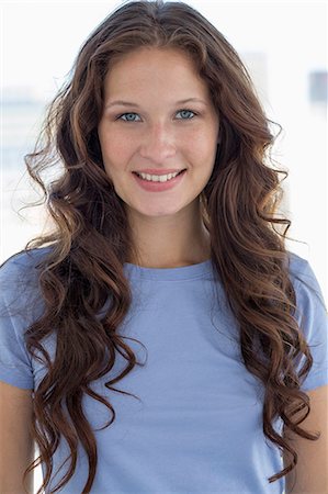 Portrait of a woman smiling Stock Photo - Premium Royalty-Free, Code: 6108-06908062