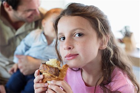 sister - Portrait of a girl eating bread Stock Photo - Premium Royalty-Free, Code: 6108-06908085
