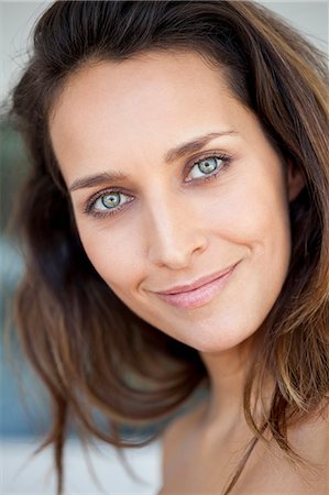 face expression happy - Portrait of a beautiful woman smiling Stock Photo - Premium Royalty-Free, Code: 6108-07969549