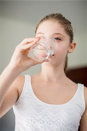 single drink - Girl drinking a glass of water Stock Photo - Premium Royalty-Free, Code: 6108-07969525