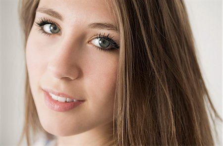 preteen beautiful face - Portrait of a happy teenage girl Stock Photo - Premium Royalty-Free, Code: 6108-07969530