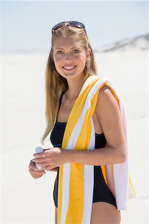 simsearch:6108-06904674,k - Portrait of a beautiful woman standing on the beach Stock Photo - Premium Royalty-Free, Code: 6108-08662351