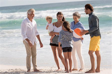 Happy multi-generation family enjoying on beach Stock Photo - Premium Royalty-Free, Code: 6108-08662662