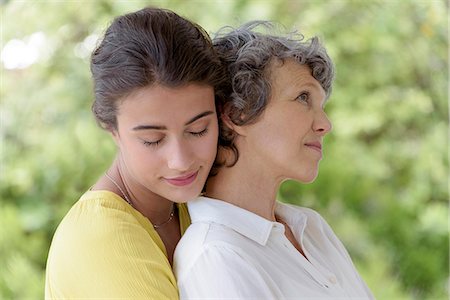 simsearch:6108-08663358,k - Loving young woman hugging her mother Photographie de stock - Premium Libres de Droits, Code: 6108-08662716