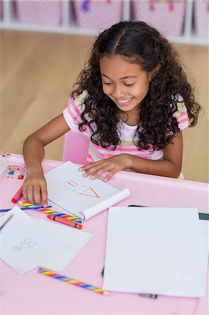 simsearch:622-06163998,k - Happy little girl doing homework on table Stock Photo - Premium Royalty-Free, Code: 6108-08662817