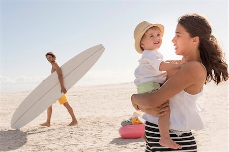 family beach pictures with baby - Happy young family enjoying on beach Stock Photo - Premium Royalty-Free, Code: 6108-08663282